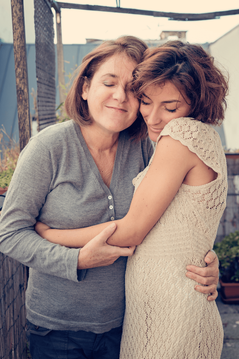 mother and daughter embracing