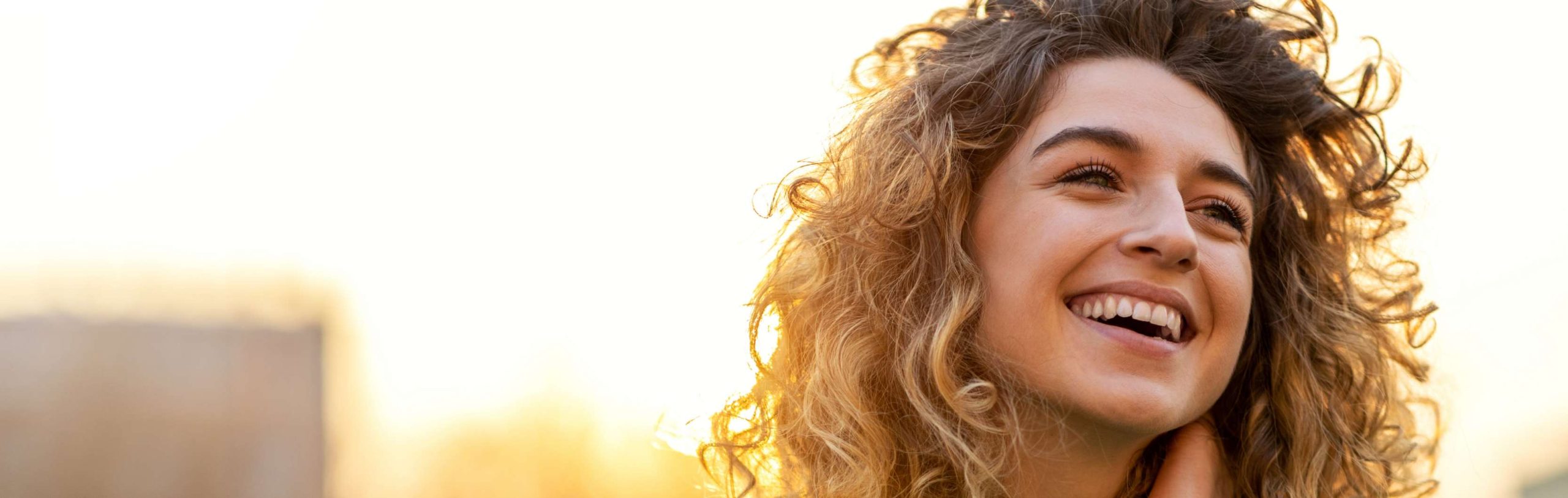 woman smiling in the sun