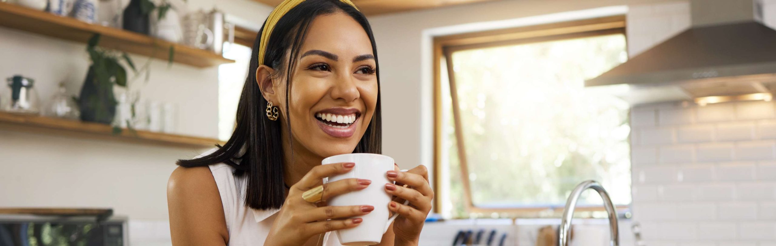 lady smiling drinking coffee