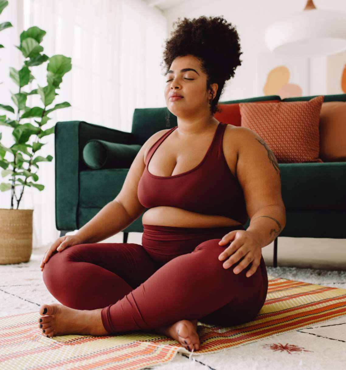 lady doing yoga inside