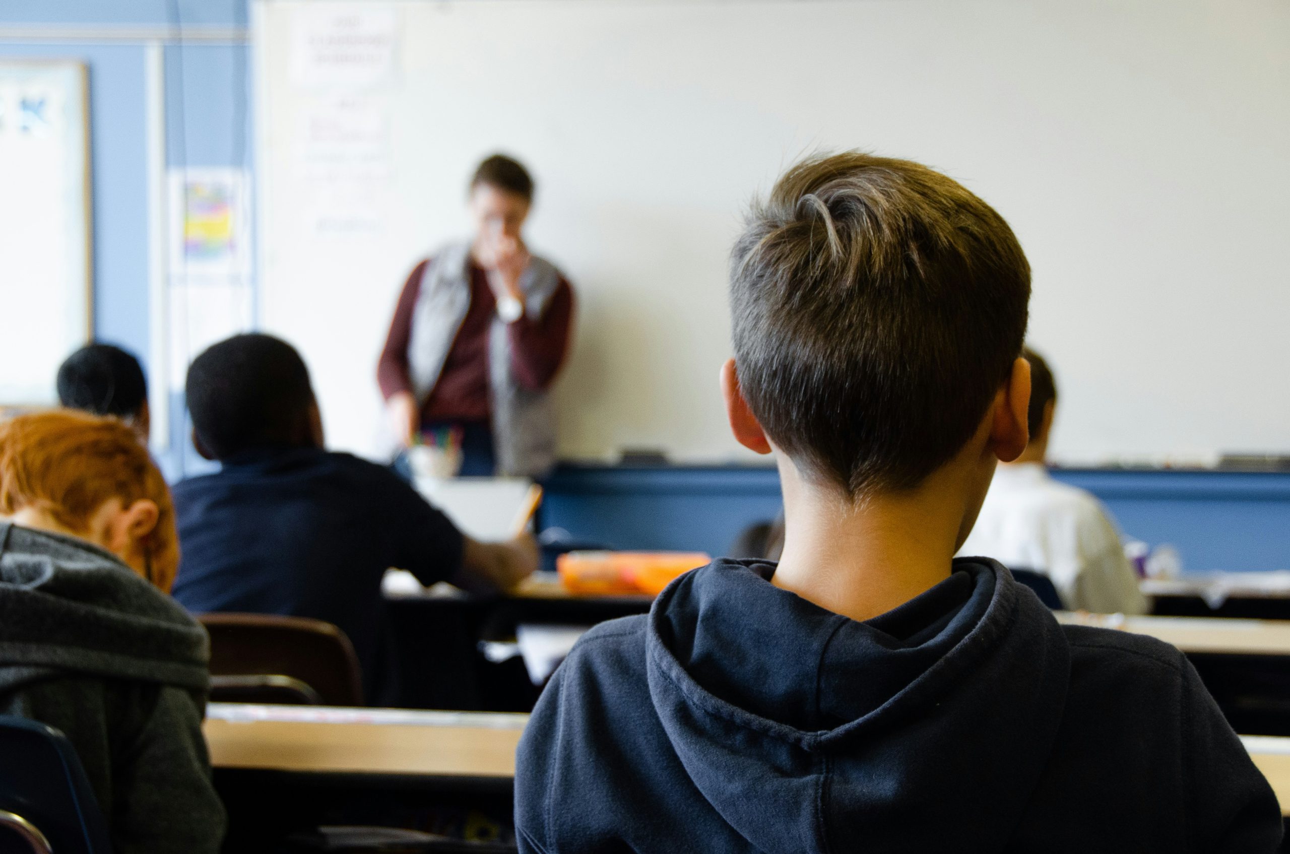 a young boy in a school classroom