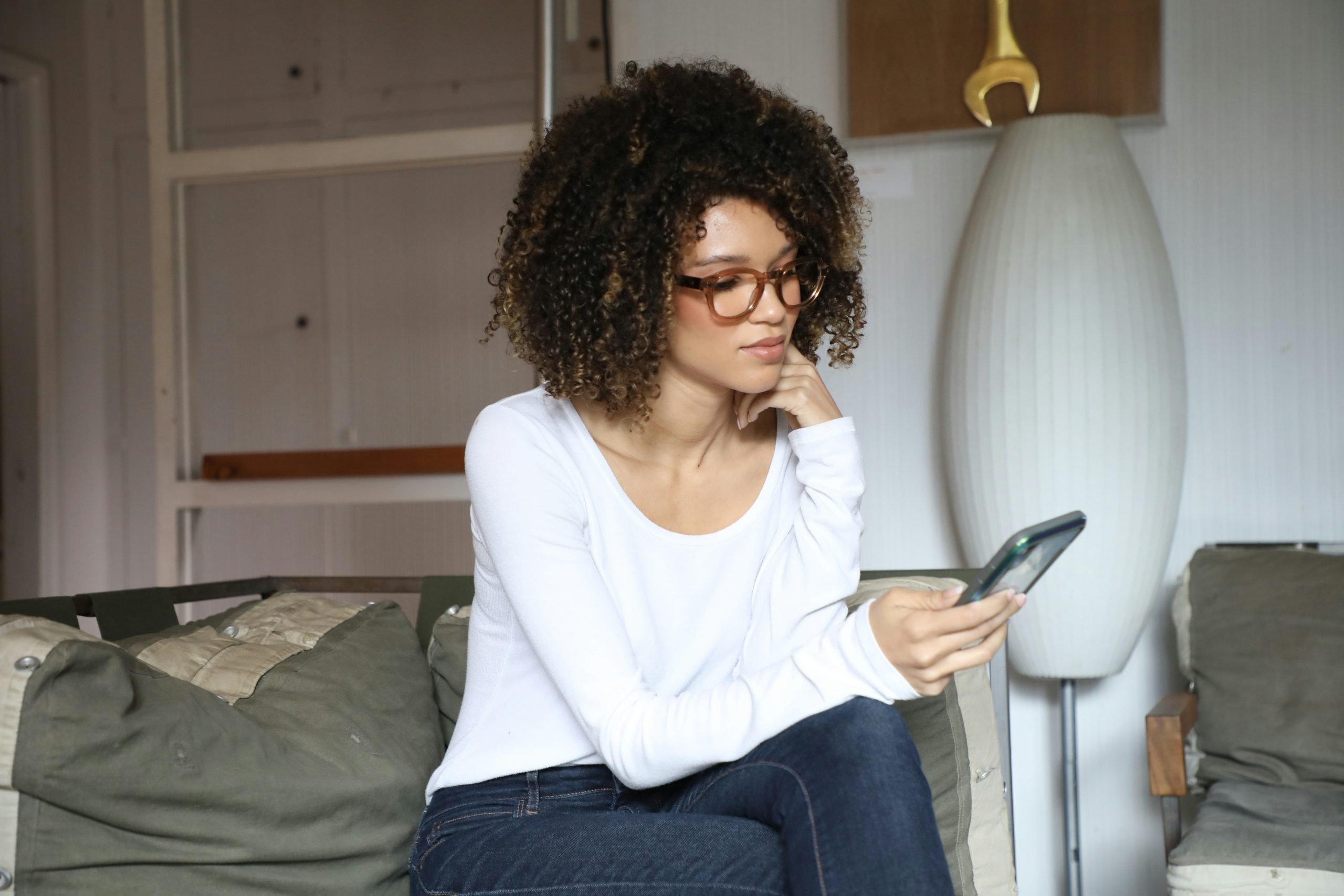 young woman looking at her cell phone
